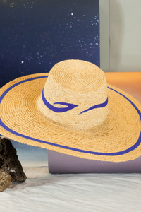 Cosmica raffia straw hat with flat crown and hand-sewn épuré fabric curves

