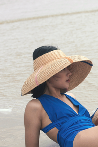 Rainbow raffia straw crownless hat with downturn brim 
