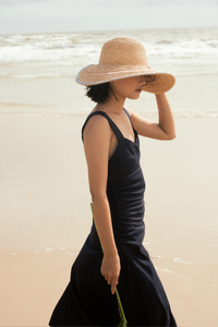 Sunrise raffia straw hat with a round crown and V-shape detail on the brim
